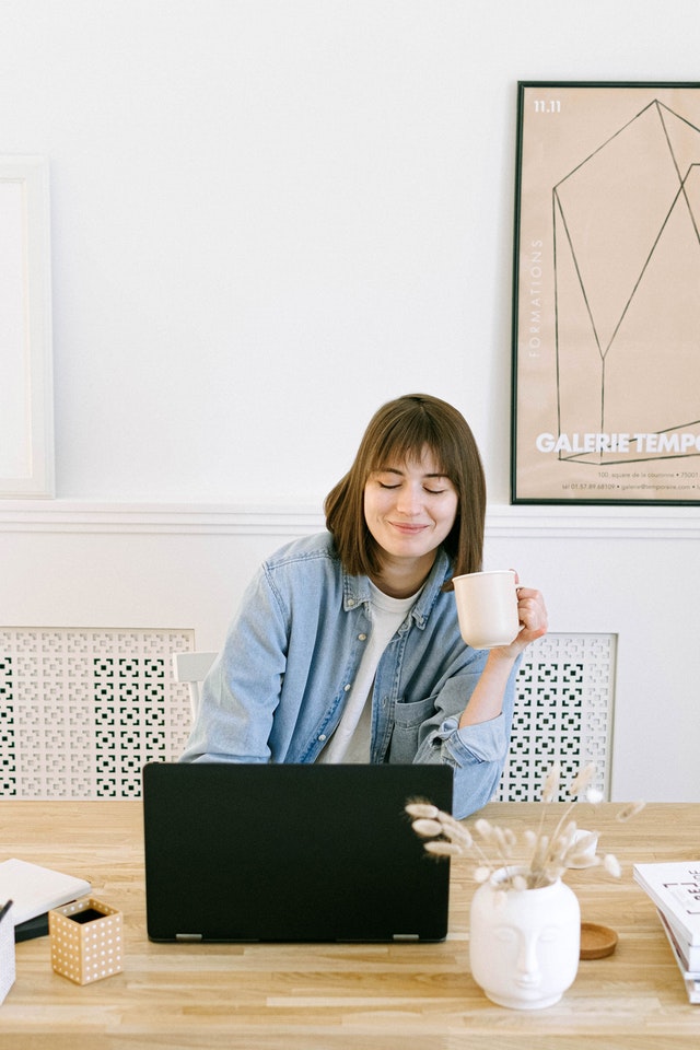 Woman sitting at laptop working on on-page SEO