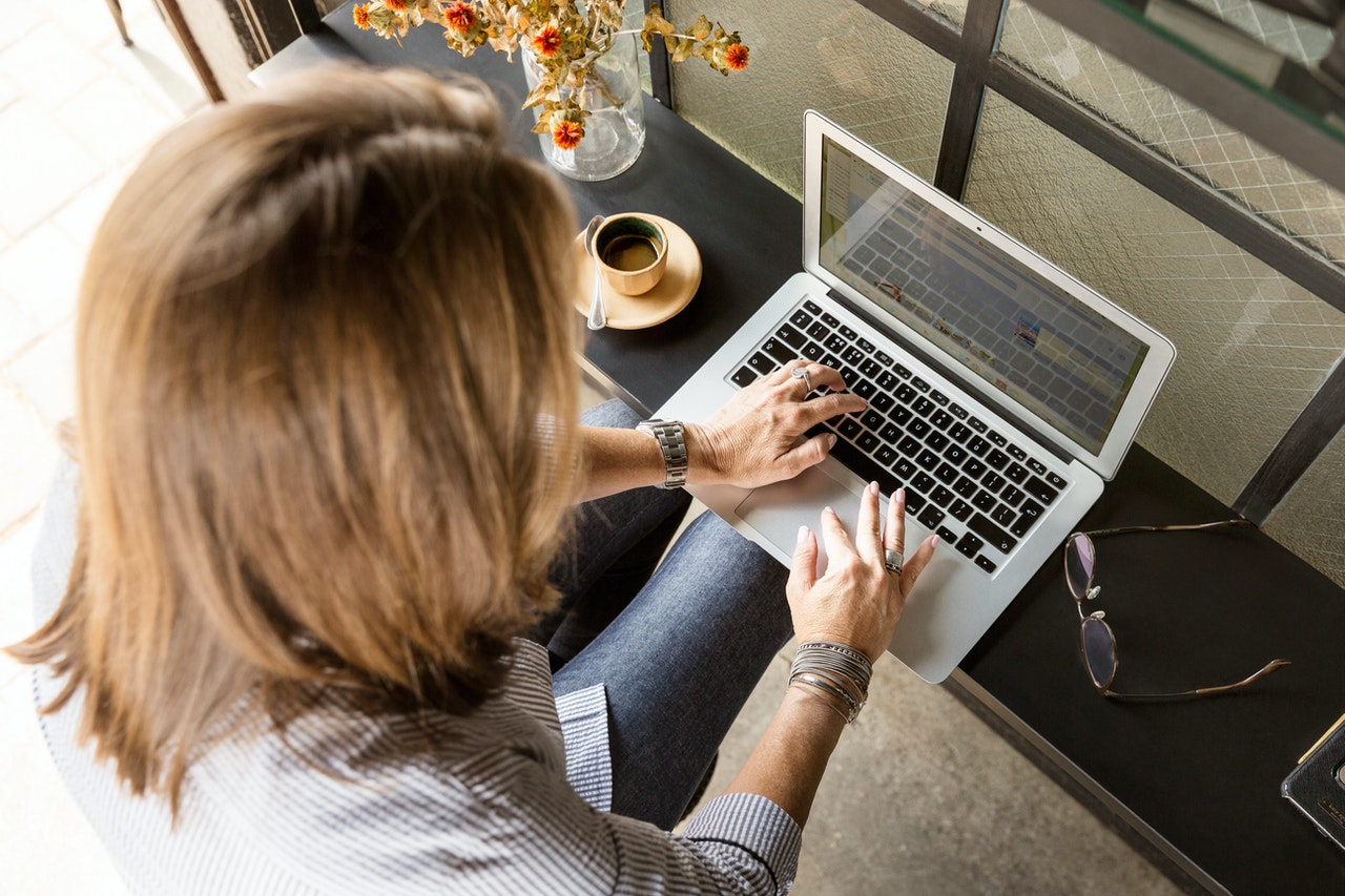 Woman typing on laptop